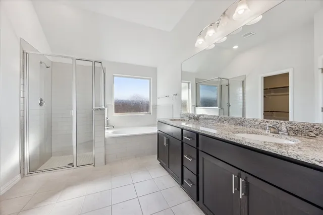 an empty room with a window and a ceiling fan
