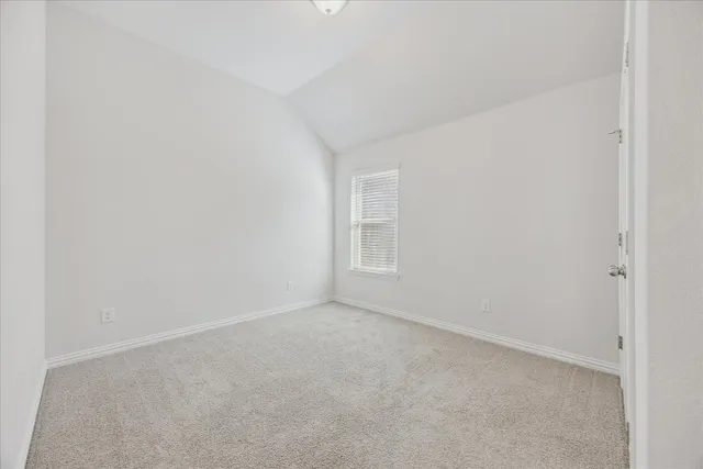 a bathroom with a granite countertop sink mirror and a bathtub