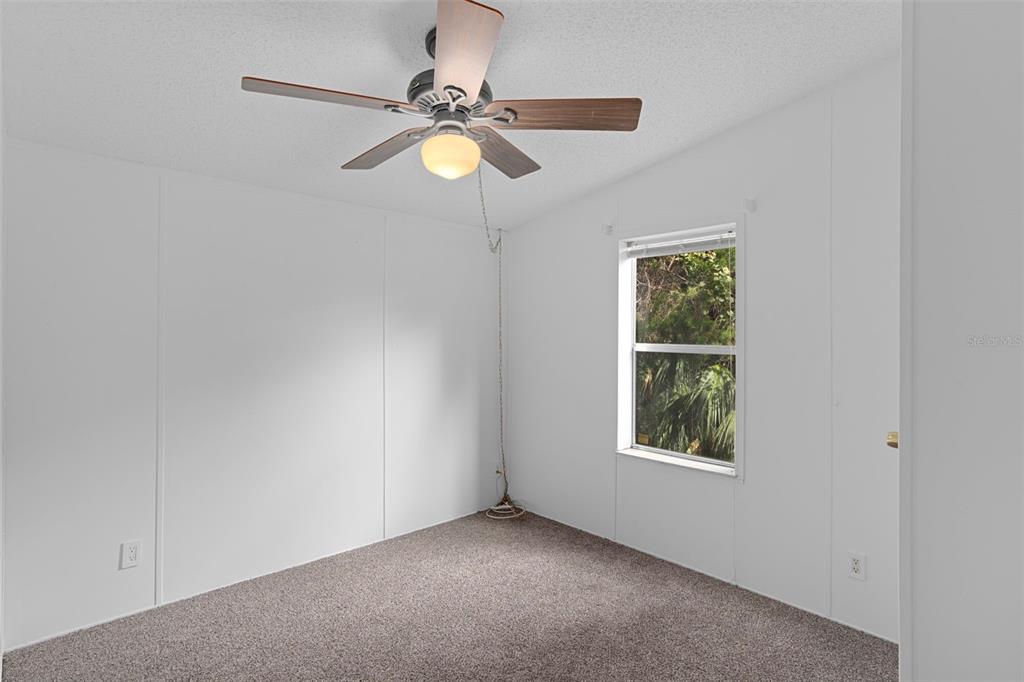 6176 South Hancock Road Homosassa, FL 34448 - Photo 11 of 33 an empty room with a window