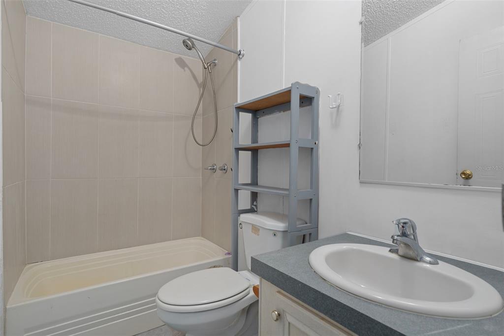 6176 South Hancock Road Homosassa, FL 34448 - Photo 12 of 33 a bathroom with a sink toilet and shower