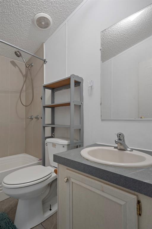 6176 South Hancock Road Homosassa, FL 34448 - Photo 13 of 33 a bathroom with a sink a toilet and shower