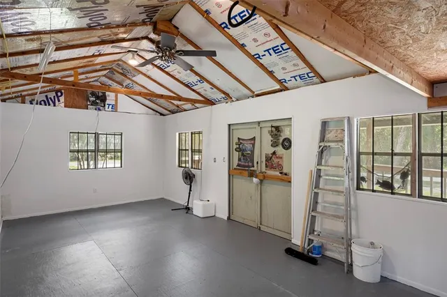 a view of a lake with a house in the background