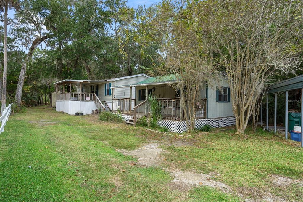 6176 South Hancock Road Homosassa, FL 34448 - Photo 33 of 33 a view of a house with backyard and sitting area