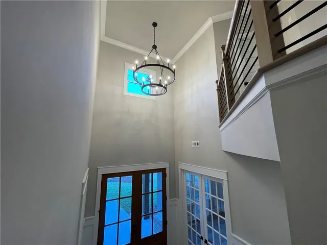 a view of a hallway with a chandelier