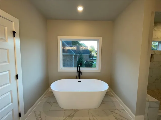 a bathroom with a sink and a window