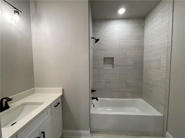 a bathroom with a bathtub and a sink