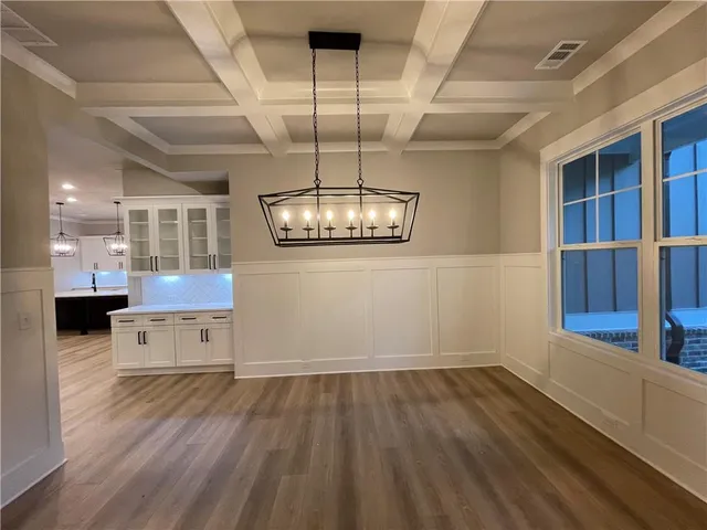 an entryway with wooden floor