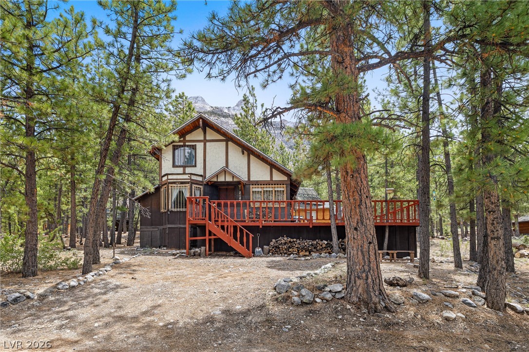 2146 Via Spes Nostra Street Mount Charleston, NV 89124 - Photo 2 of 33 Discover a charming A-frame home nestled among towering pines with a spacious wood deck.