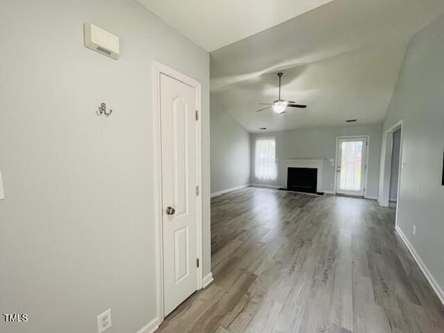 830 Northview Drive Sanford, NC 27332 - Photo 2 of 20 a view of empty room with wooden floor and fireplace