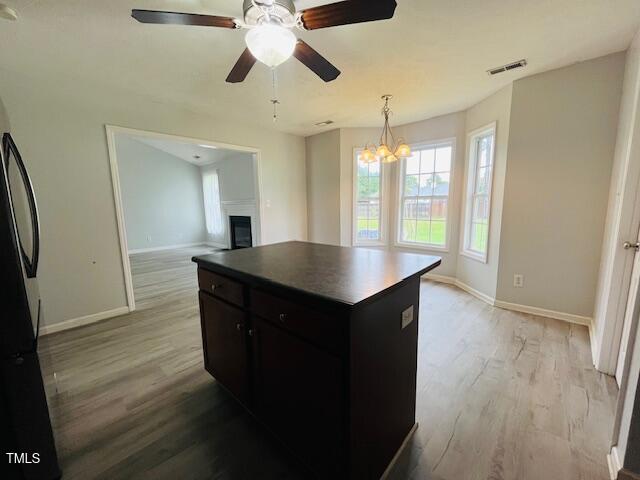 830 Northview Drive Sanford, NC 27332 - Photo 5 of 20 a kitchen with kitchen island wooden floors appliances and cabinets