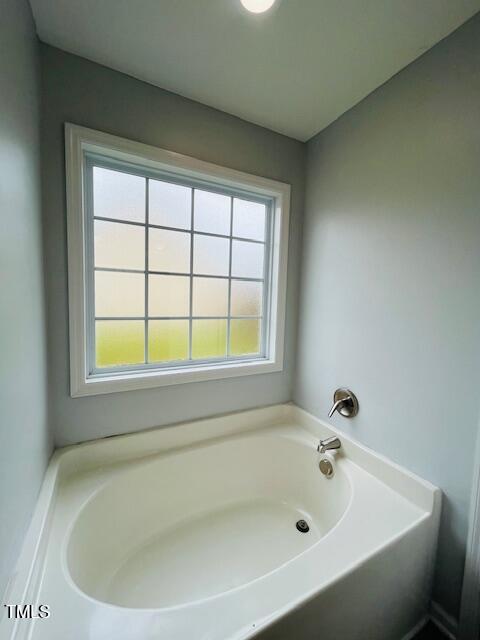 830 Northview Drive Sanford, NC 27332 - Photo 10 of 20 a white bath tub sitting next to a window