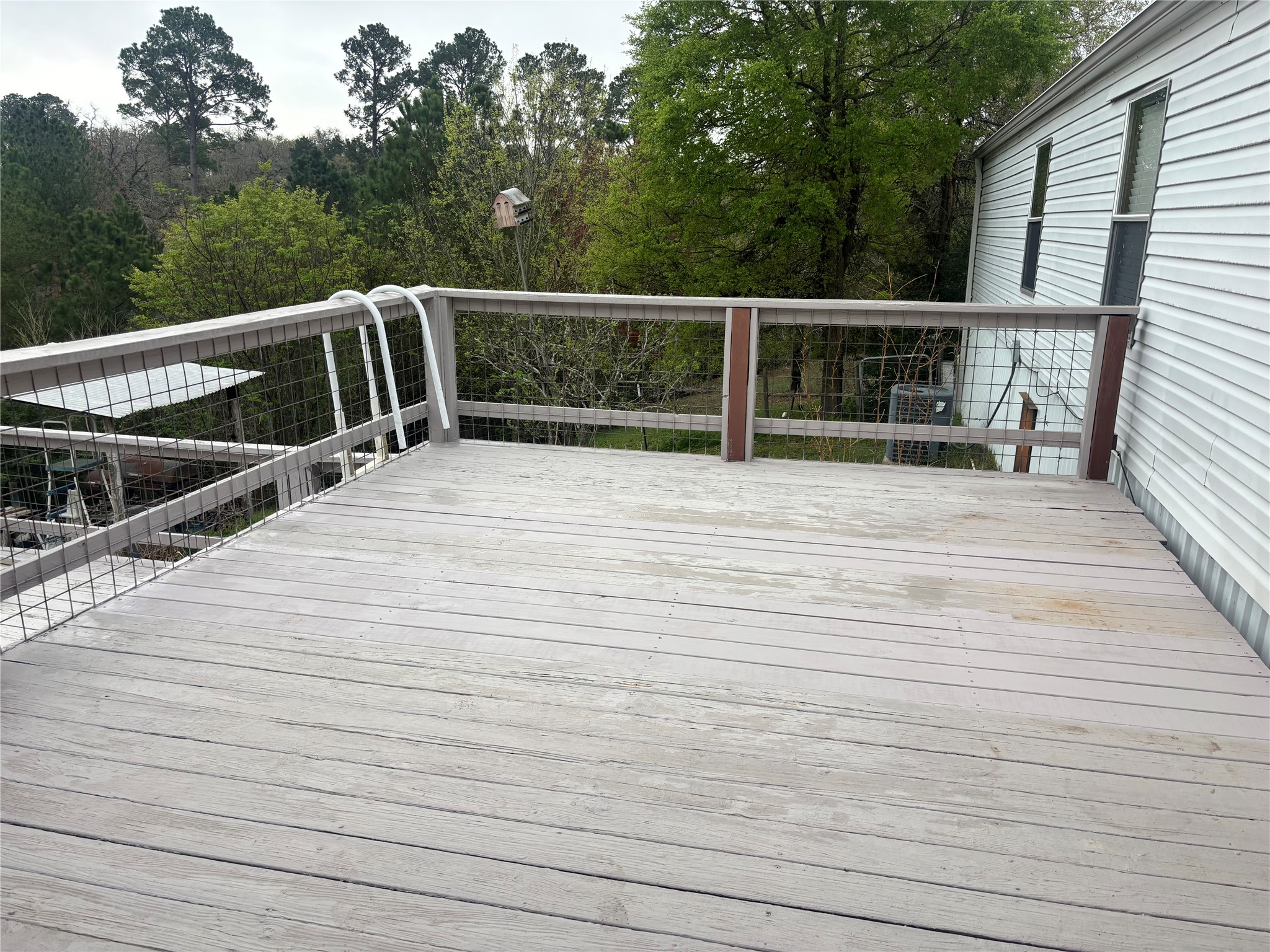 151 Cottle Town Road Smithville, TX 78957 - Photo 15 of 22 a view of deck with large trees and wooden fence