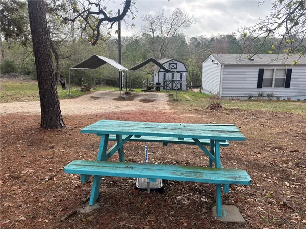 a bench sitting in the middle of a park