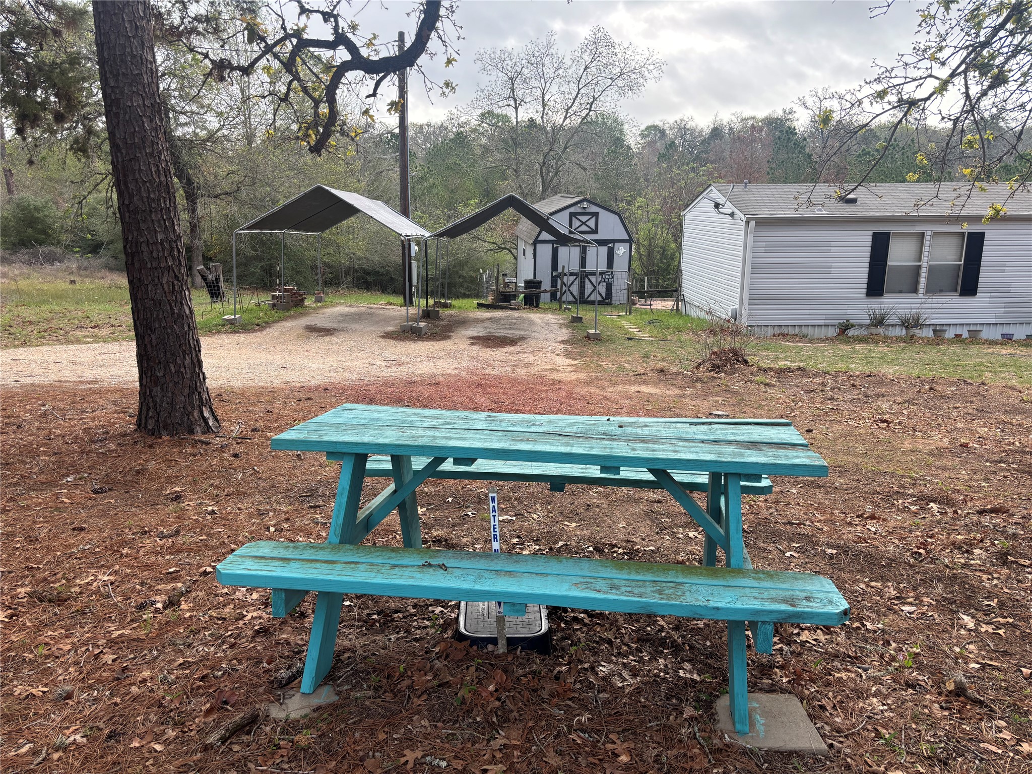 151 Cottle Town Road Smithville, TX 78957 - Photo 5 of 22 a bench sitting in the middle of a park