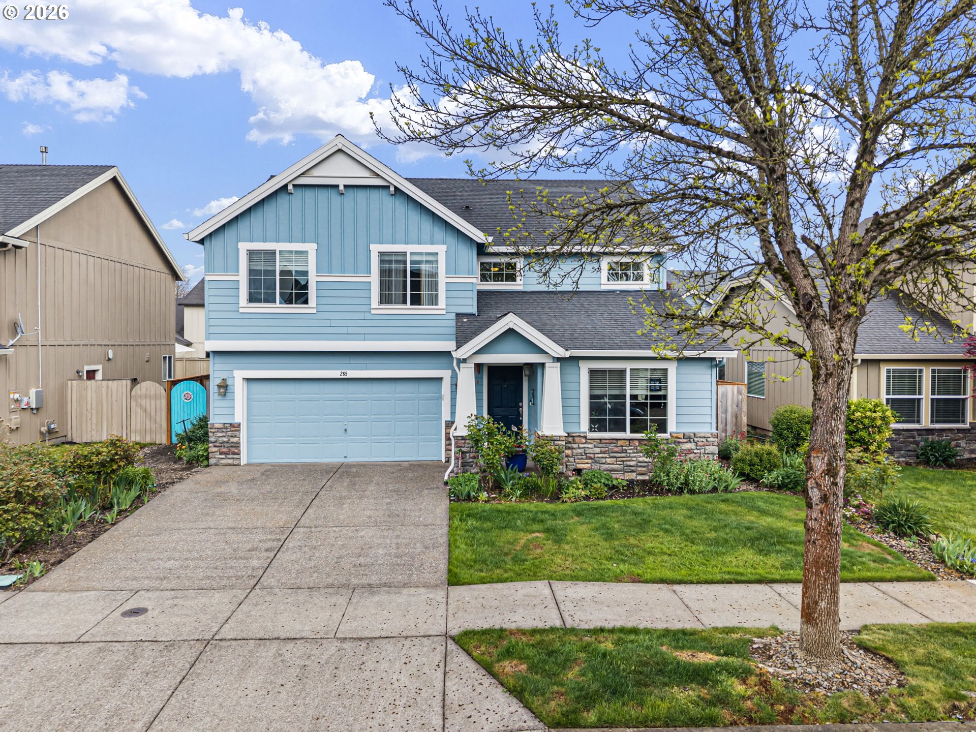 a front view of house with yard and green space
