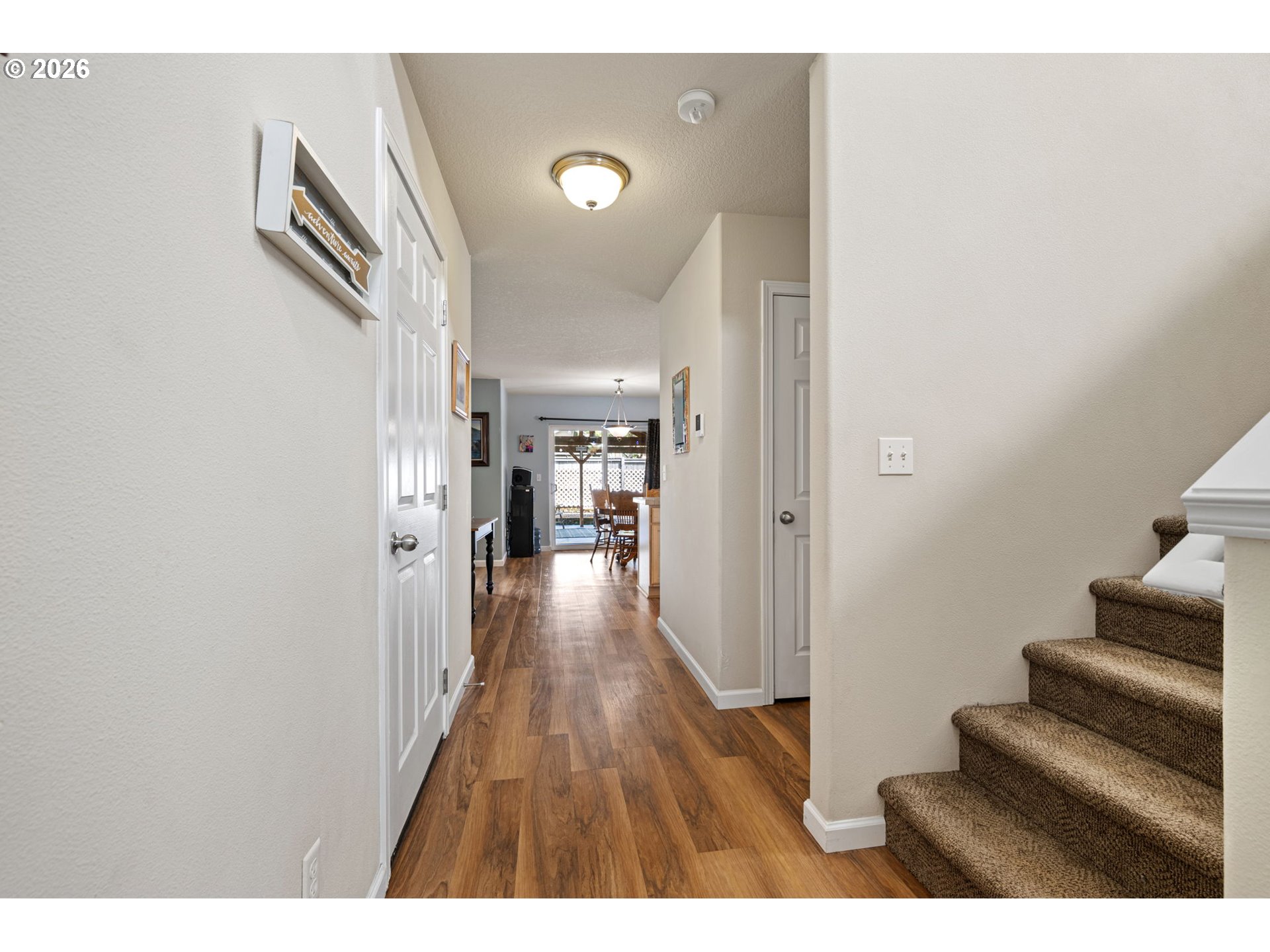 265 Southeast Casting Street Albany, OR 97322 - Photo 15 of 48 a view of a hallway with wooden floor and staircase