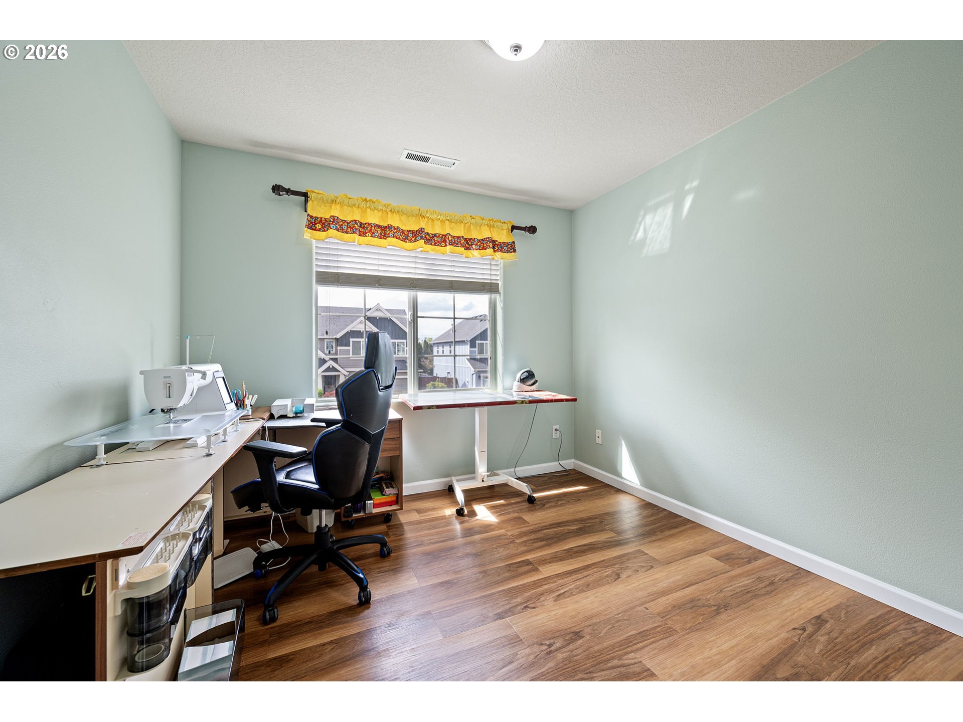 265 Southeast Casting Street Albany, OR 97322 - Photo 26 of 48 a view of workspace with wooden floor windows