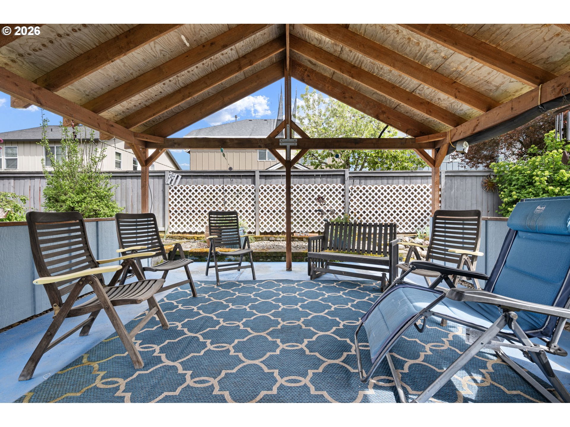 265 Southeast Casting Street Albany, OR 97322 - Photo 31 of 48 a view of a patio with table and chairs with wooden floor