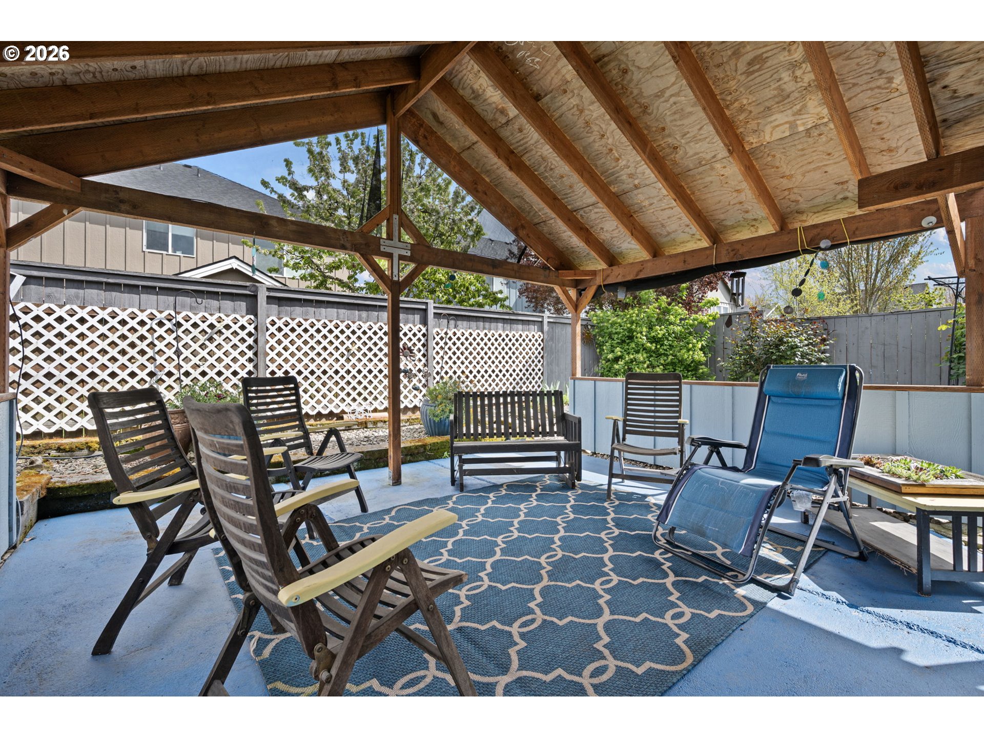 265 Southeast Casting Street Albany, OR 97322 - Photo 32 of 48 a patio with glass top table and chairs