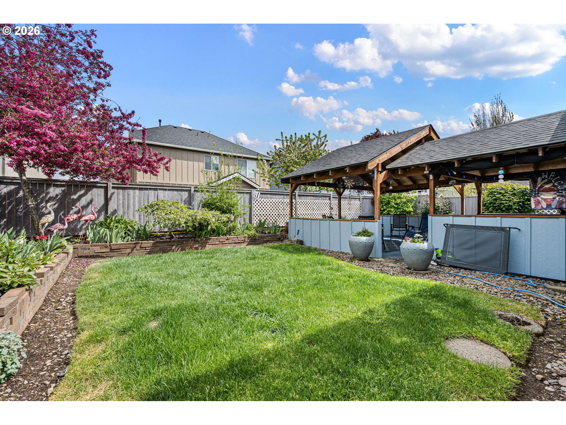 265 Southeast Casting Street Albany, OR 97322 - Photo 34 of 48 a backyard of a house with table and chairs