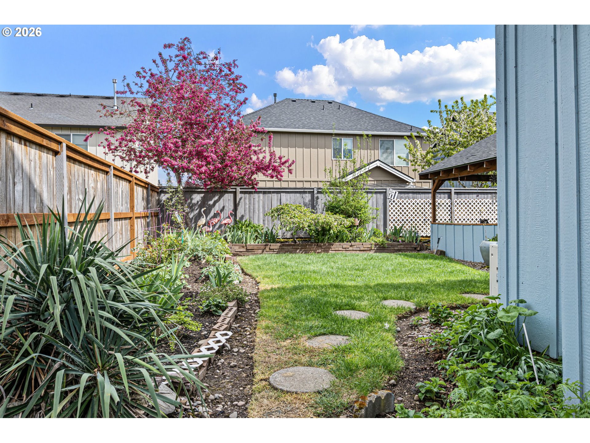 265 Southeast Casting Street Albany, OR 97322 - Photo 35 of 48 a view of a house with a yard and potted plants
