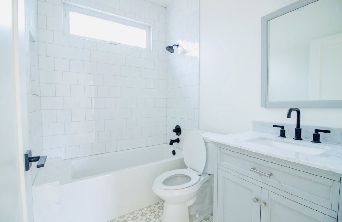 1903 West 30th Street Austin, TX 78703 - Photo 5 of 12 a bathroom with a sink a toilet and shower