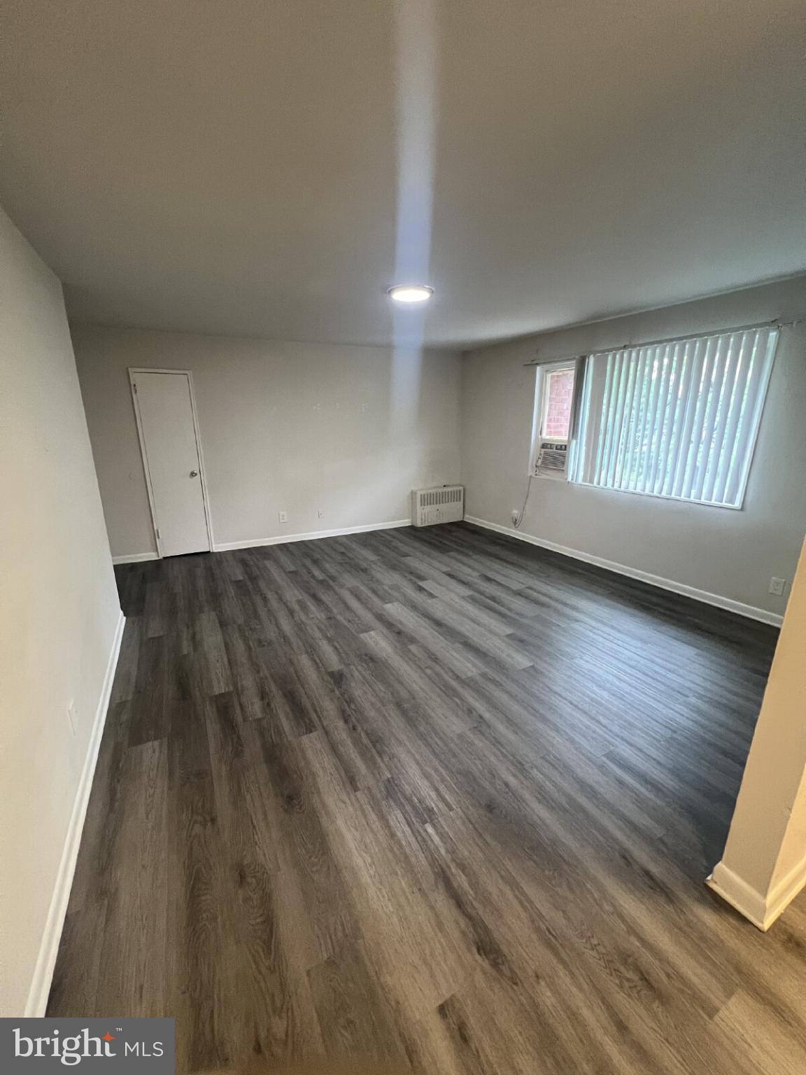 14404 Gemstone Drive, Unit 302 Woodbridge, VA 22191 - Photo 11 of 16 wooden floor in a hall with an entryway