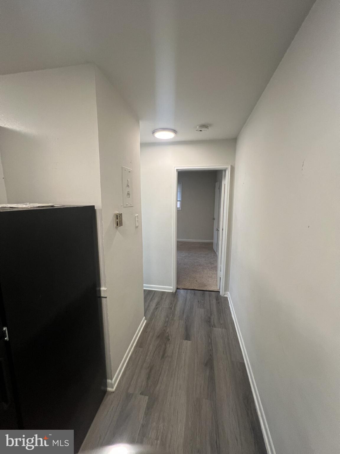 14404 Gemstone Drive, Unit 302 Woodbridge, VA 22191 - Photo 6 of 16 wooden floor in an empty room