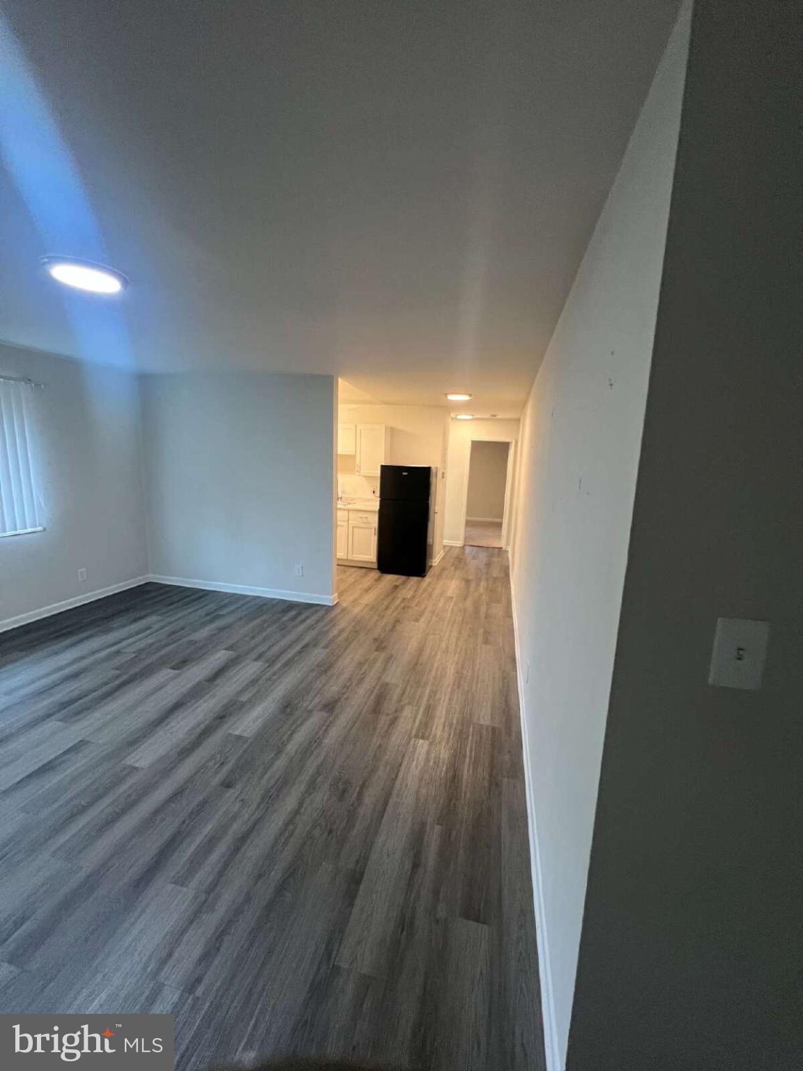 14404 Gemstone Drive, Unit 302 Woodbridge, VA 22191 - Photo 8 of 16 a view of a livingroom with wooden floor