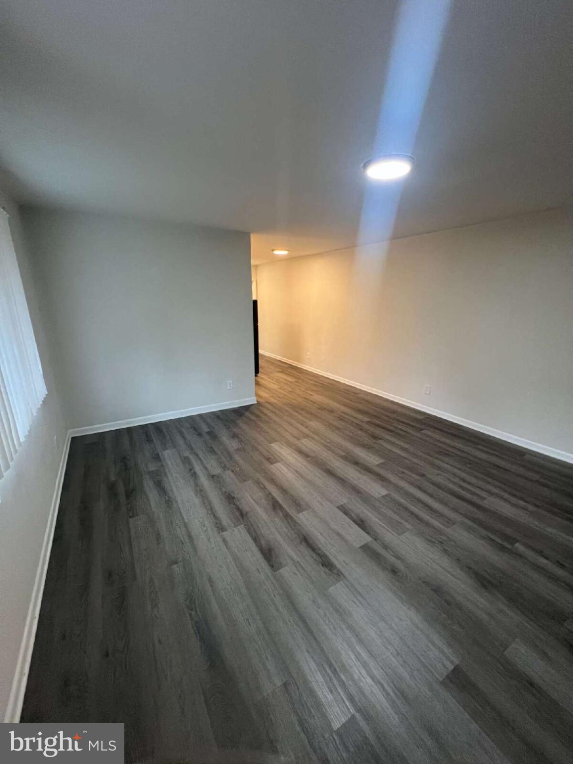 14404 Gemstone Drive, Unit 302 Woodbridge, VA 22191 - Photo 10 of 16 a view of an empty room and wooden floor
