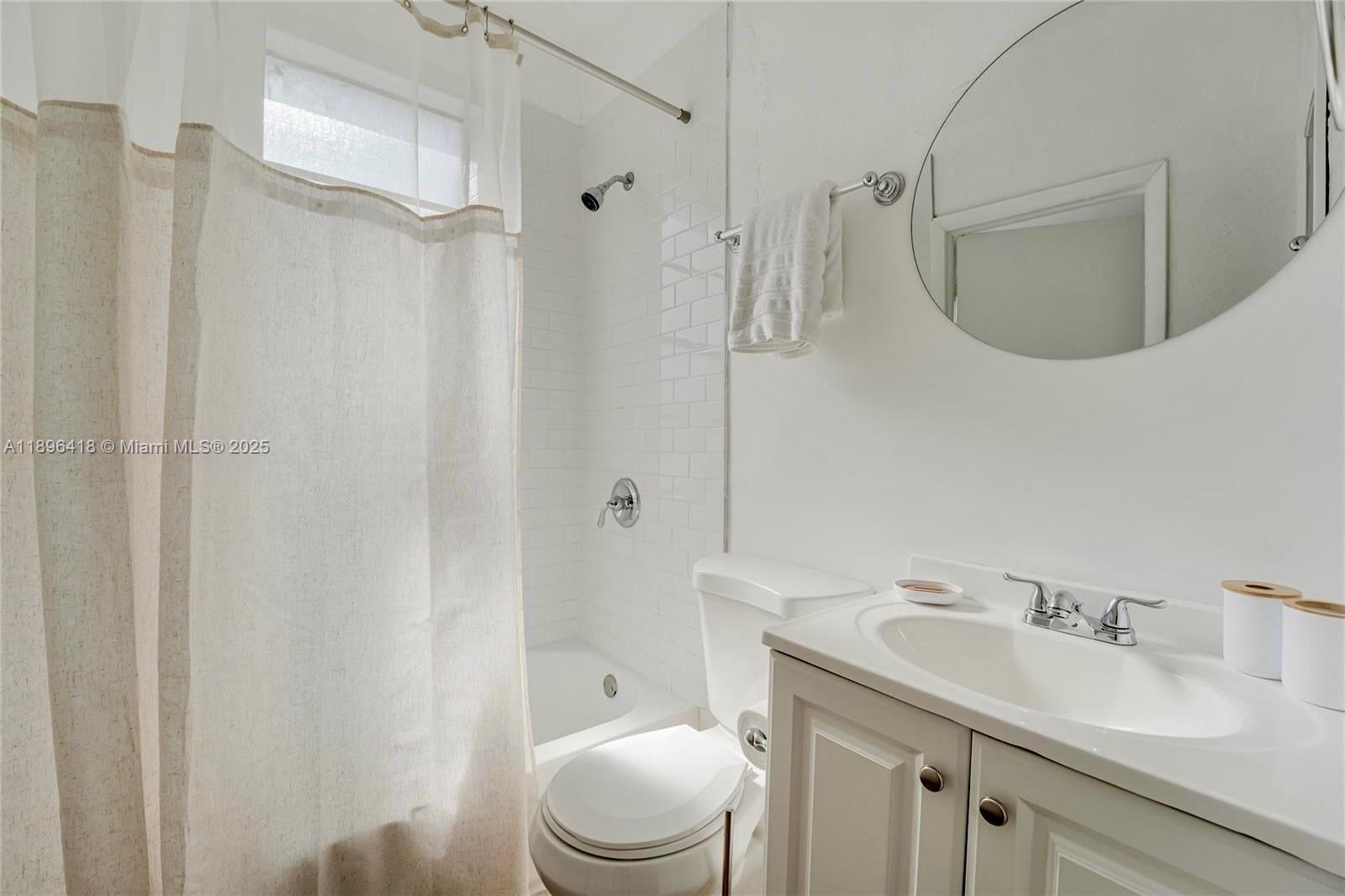 301 Southwest 10th Avenue, Unit 8 Miami, FL 33130 - Photo 12 of 14 a bathroom with a sink a toilet and shower
