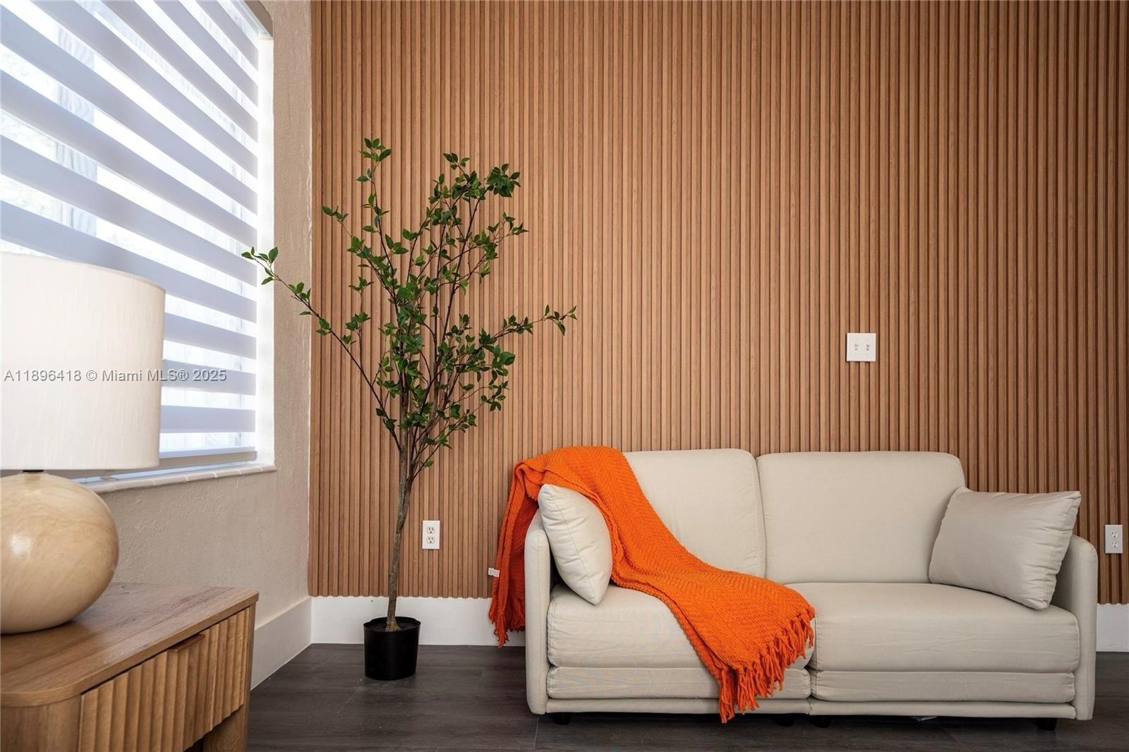 301 Southwest 10th Avenue, Unit 8 Miami, FL 33130 - Photo 8 of 14 a living room with a couch and a potted plant