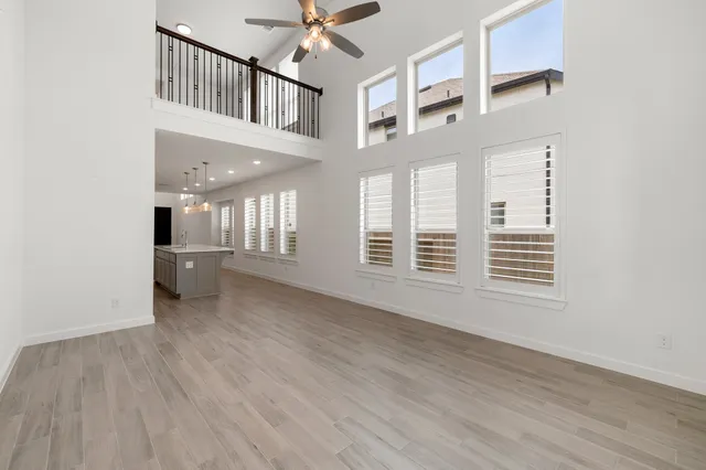 a bathroom with a double vanity sink mirror and shower