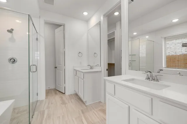 a bathroom with a bathtub and a shower