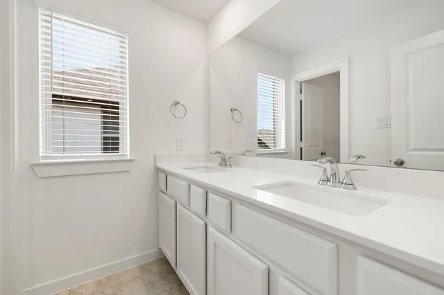 a bathroom with a toilet and a bathtub