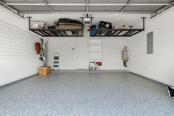 a view of a porch with a floor to ceiling windows and a table