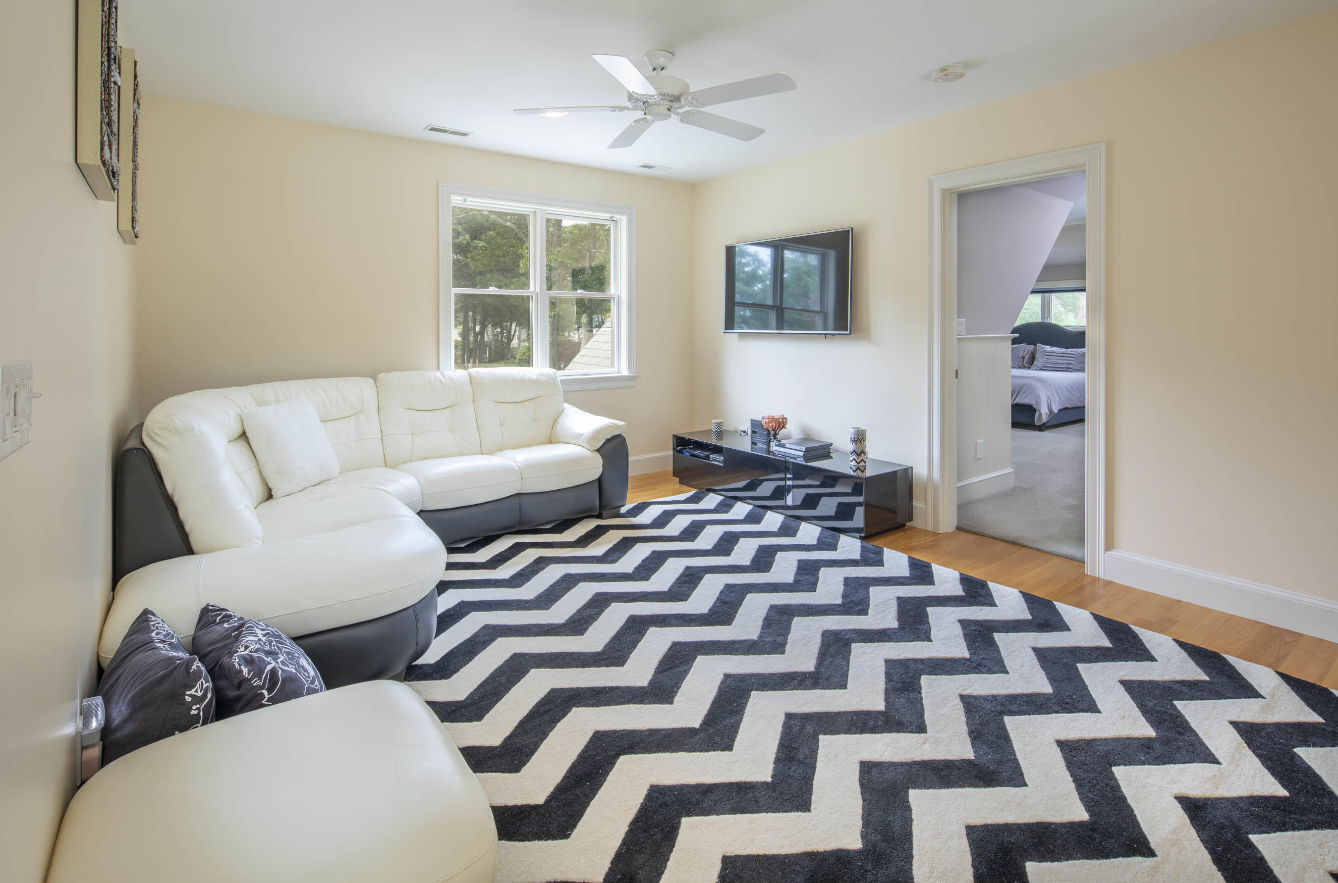 11 Reflection Drive Sandwich, MA 02563 - Photo 16 of 24 a living room with furniture and a rug