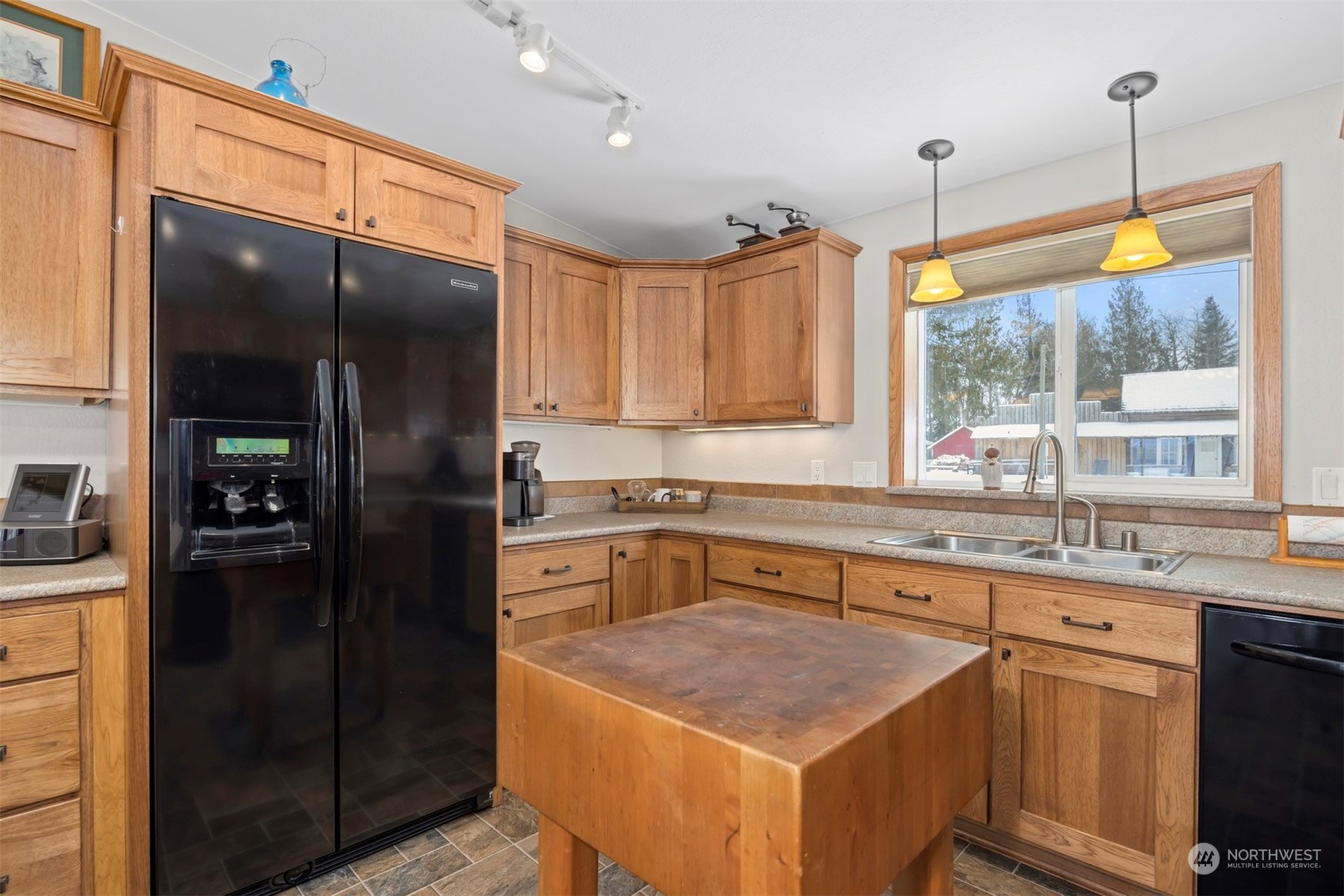 2095 Timon Road Everson, WA 98247 - Photo 13 of 40 a kitchen with a sink a counter top space cabinets and stainless steel appliances