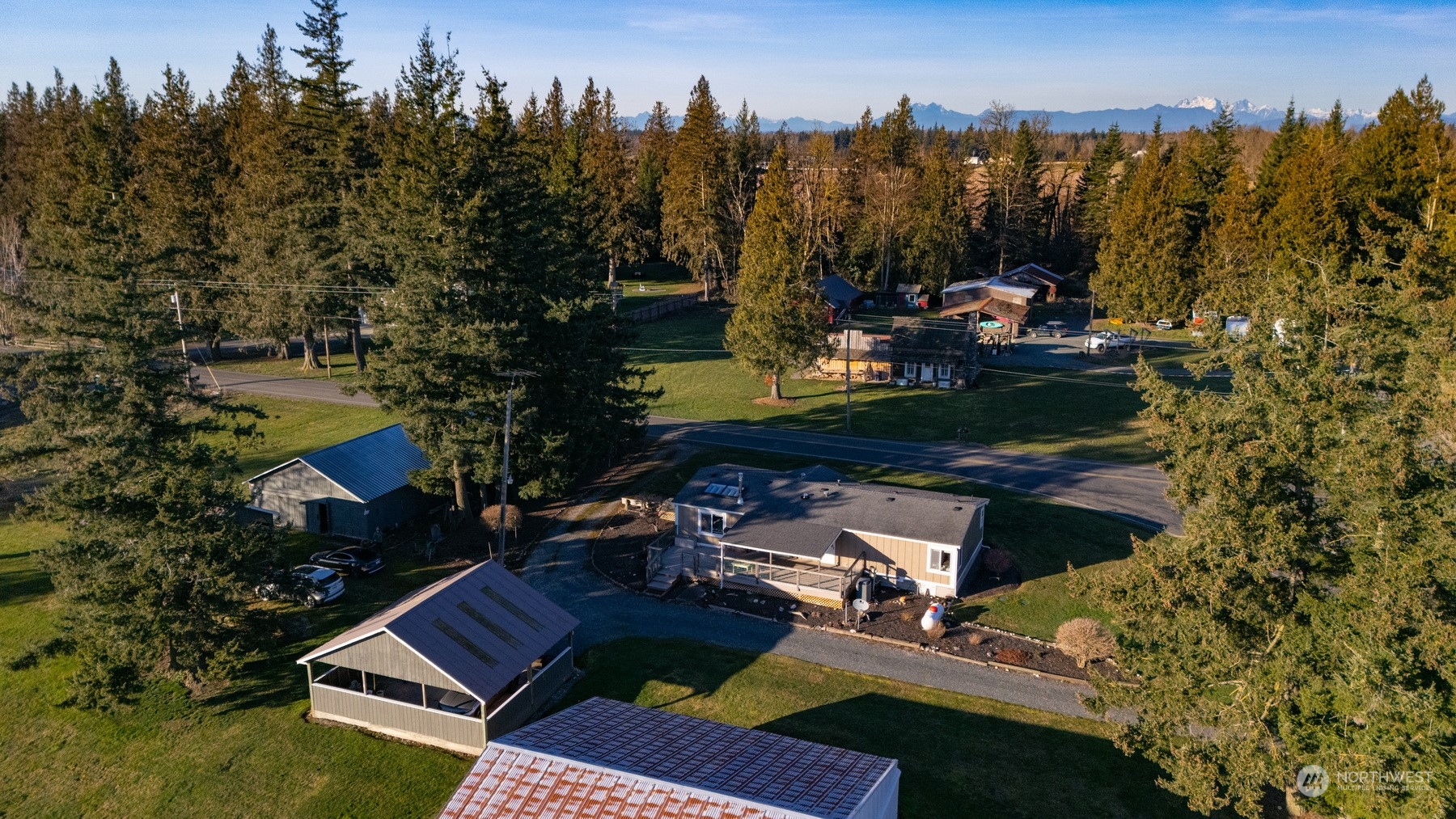 2095 Timon Road Everson, WA 98247 - Photo 35 of 40 a view of swimming pool with outdoor seating and trees in the background