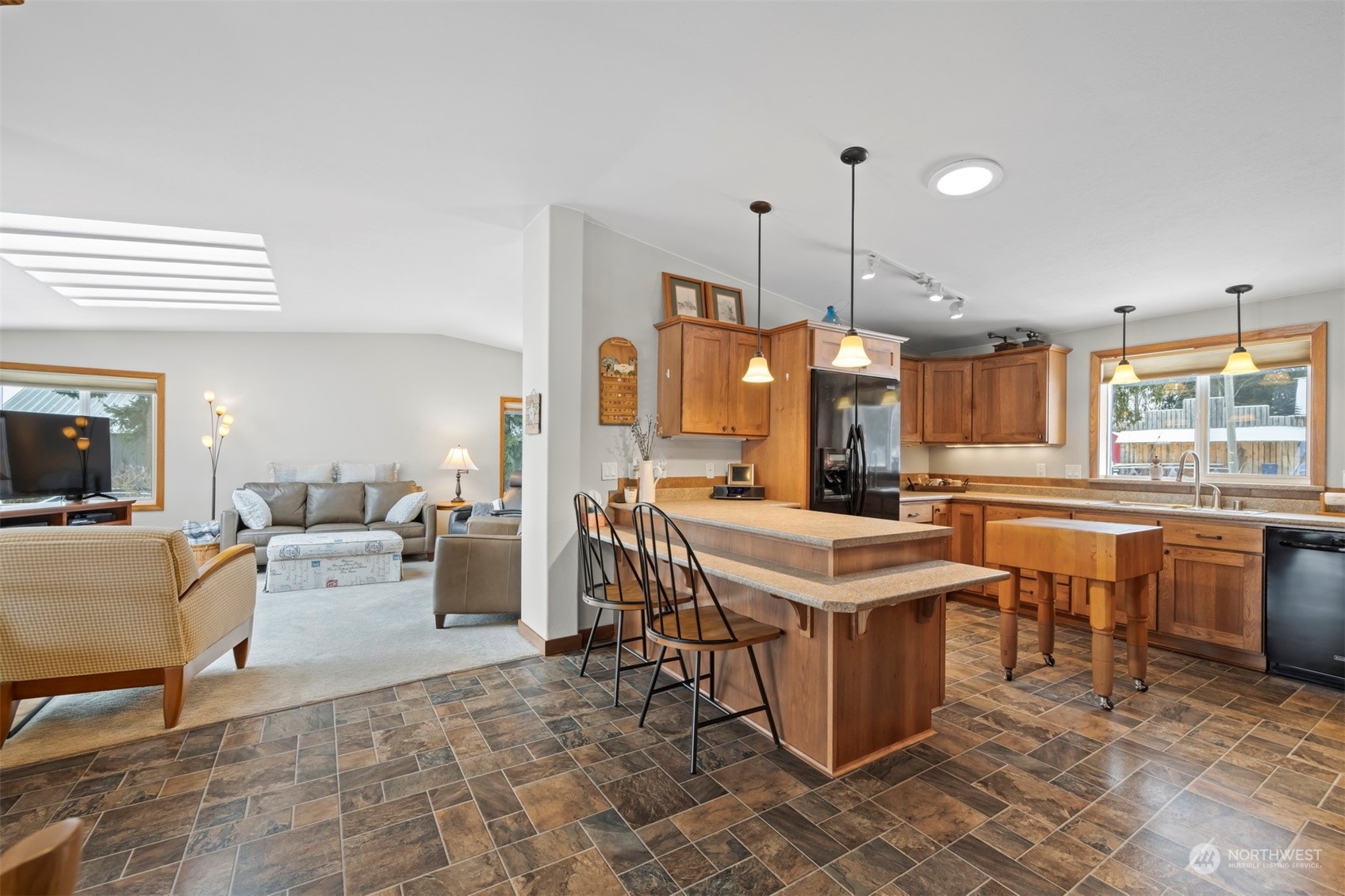 2095 Timon Road Everson, WA 98247 - Photo 8 of 40 a open kitchen with stainless steel appliances kitchen island granite countertop a sink a counter top space and living room view