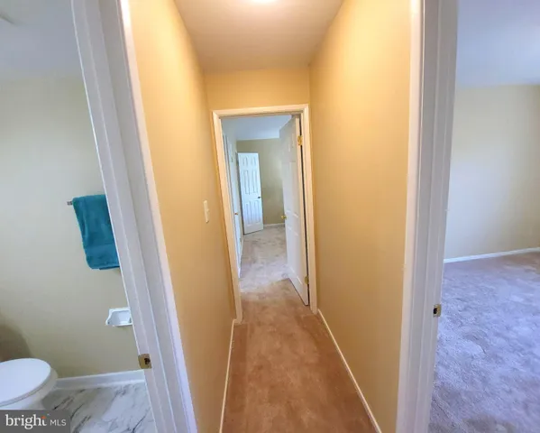 a view of bathroom with a sink and toilet