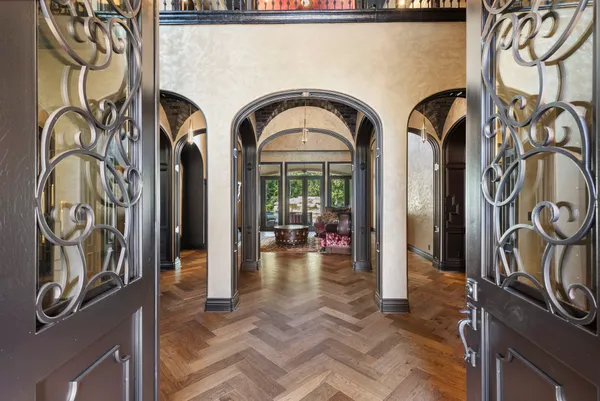 a view of an entryway with a fireplace cabinet and front door