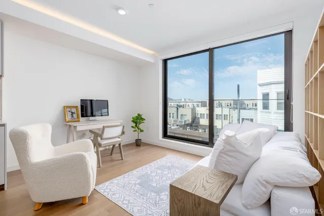 a kitchen with a table and chairs