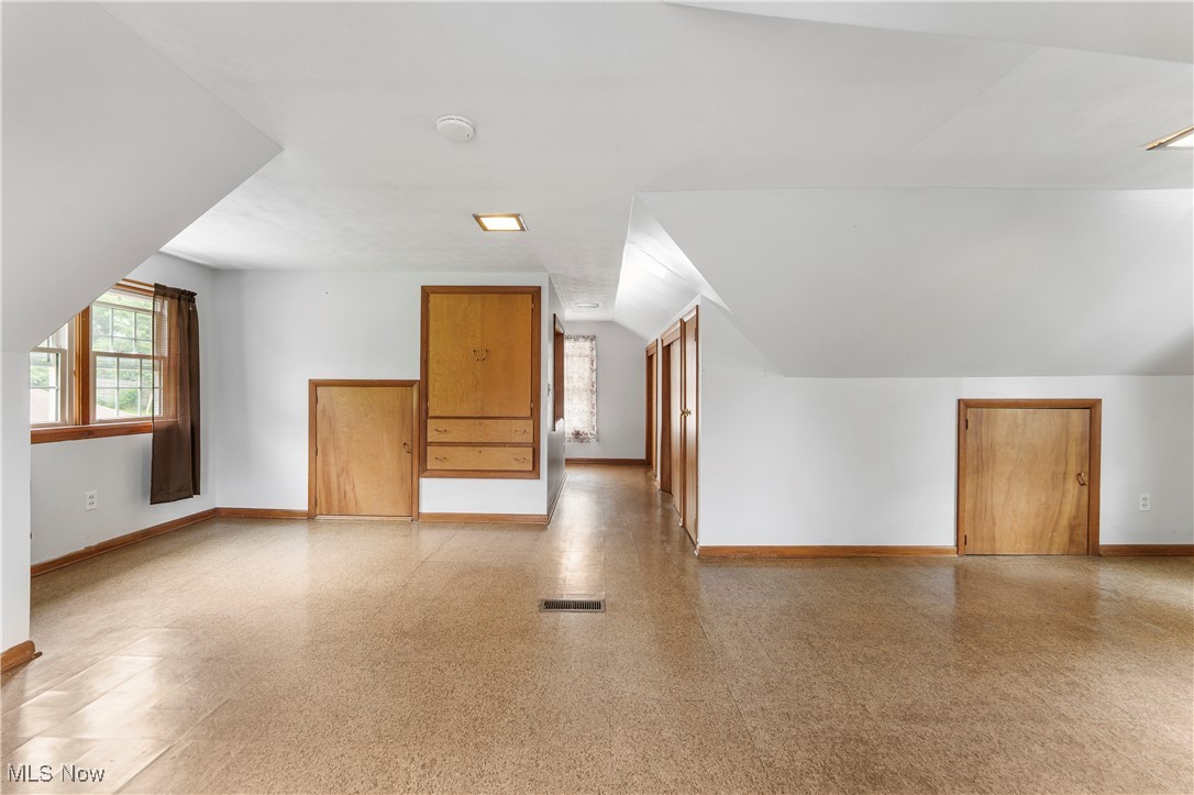 1703 Ferndale Road Northwest Canton, OH 44709 - Photo 20 of 34 Bonus room featuring baseboards and vaulted ceiling