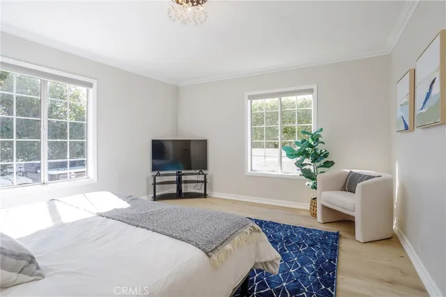 a bedroom with a bed and a chair