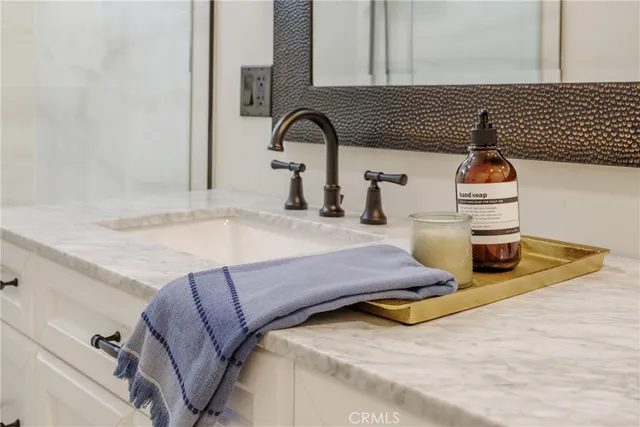 a bedroom with a bed and dresser