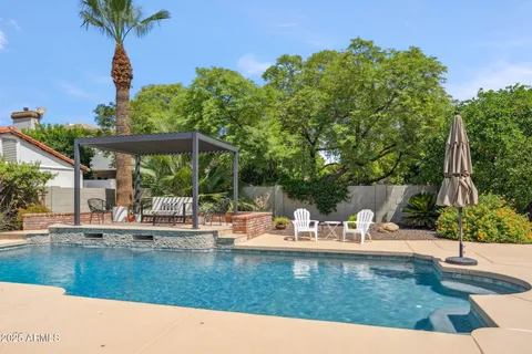 a view of a swimming pool with a patio