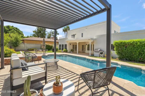 a view of a patio with couches table and chairs