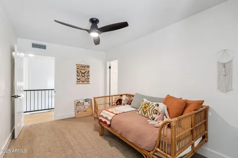 a bedroom with a bed and window