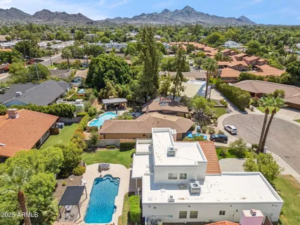 an aerial view of residential houses with outdoor space